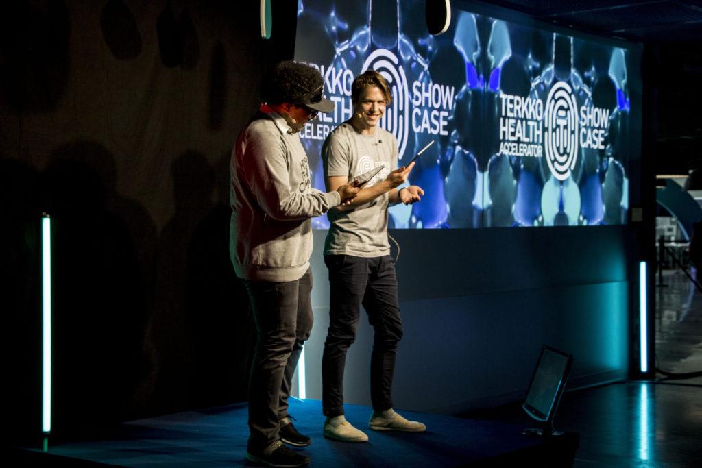 Two people on stage at an event.