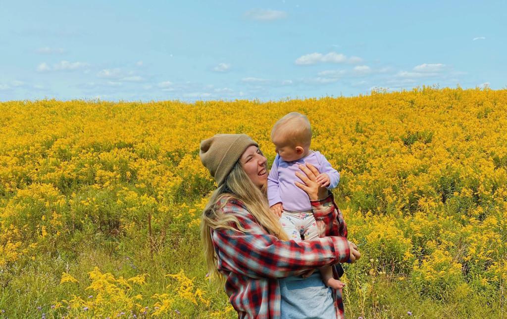 Woman holding baby in her arms.