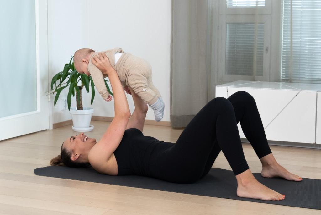 Woman holding baby.