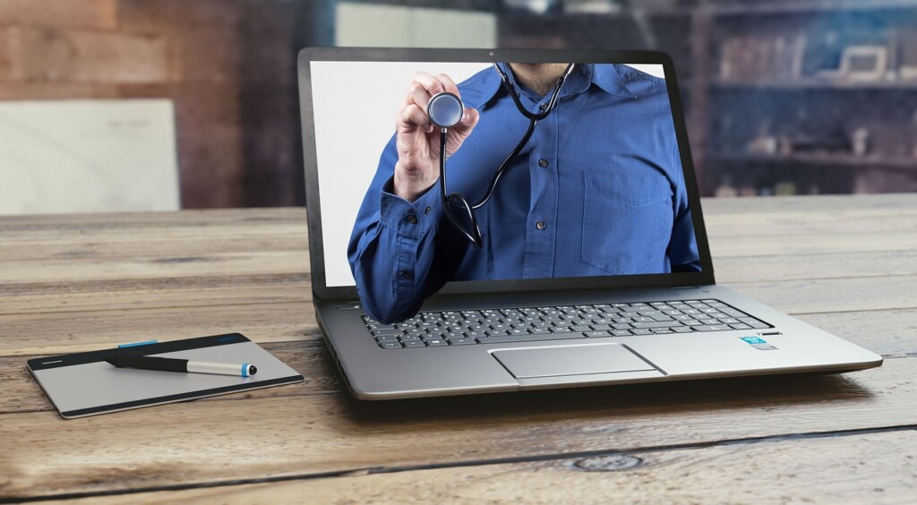 A laptop screen with a picture of a man wearing a stethoscope